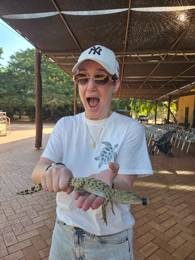 Alicia holding a small reptile